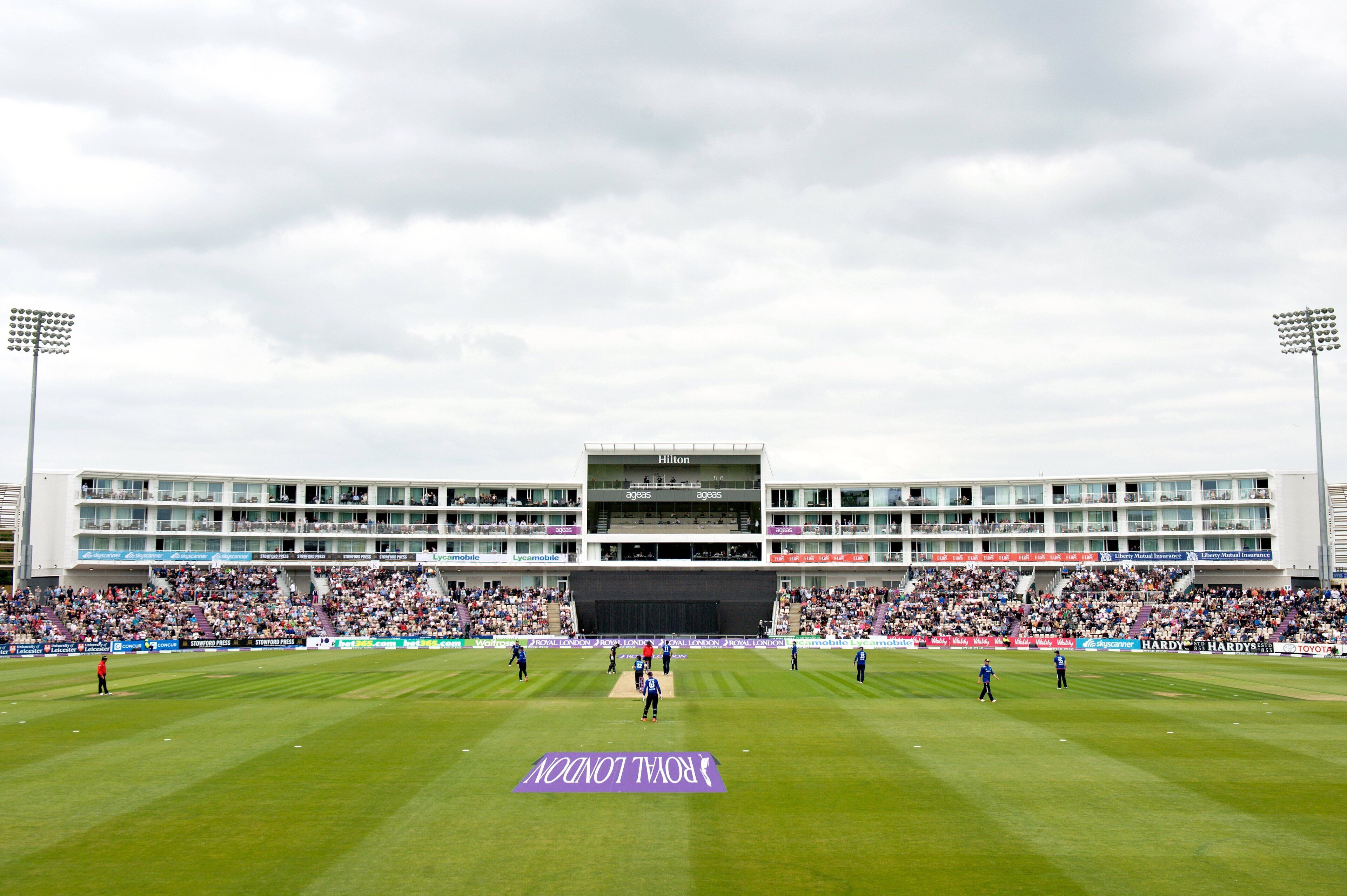 A stadium with a large seating area and a stage.