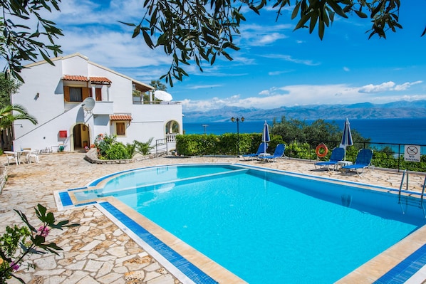 Outdoor pool, open 8:00 AM to 8:00 PM, pool umbrellas, sun loungers