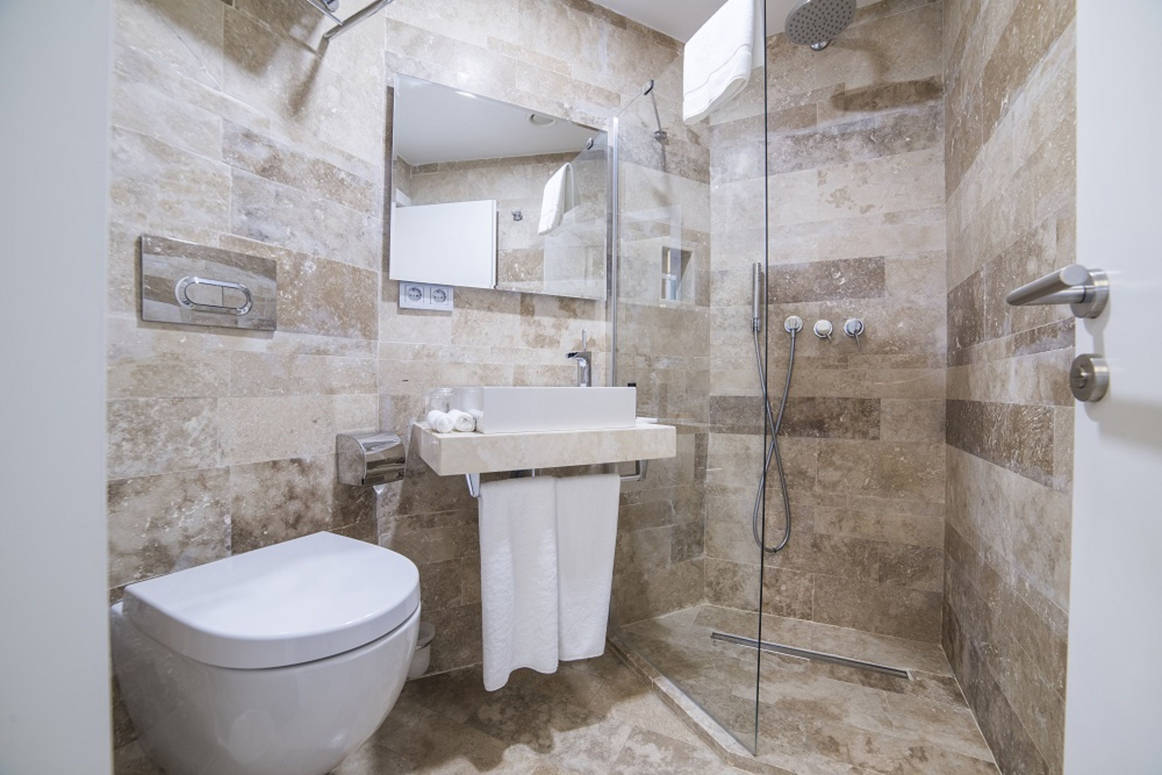 shower, rainfall showerhead, designer toiletries, hair dryer