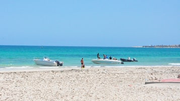 Private beach, white sand, sun-loungers, beach umbrellas
