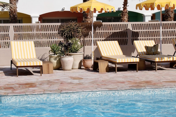 Outdoor pool, pool umbrellas, sun loungers