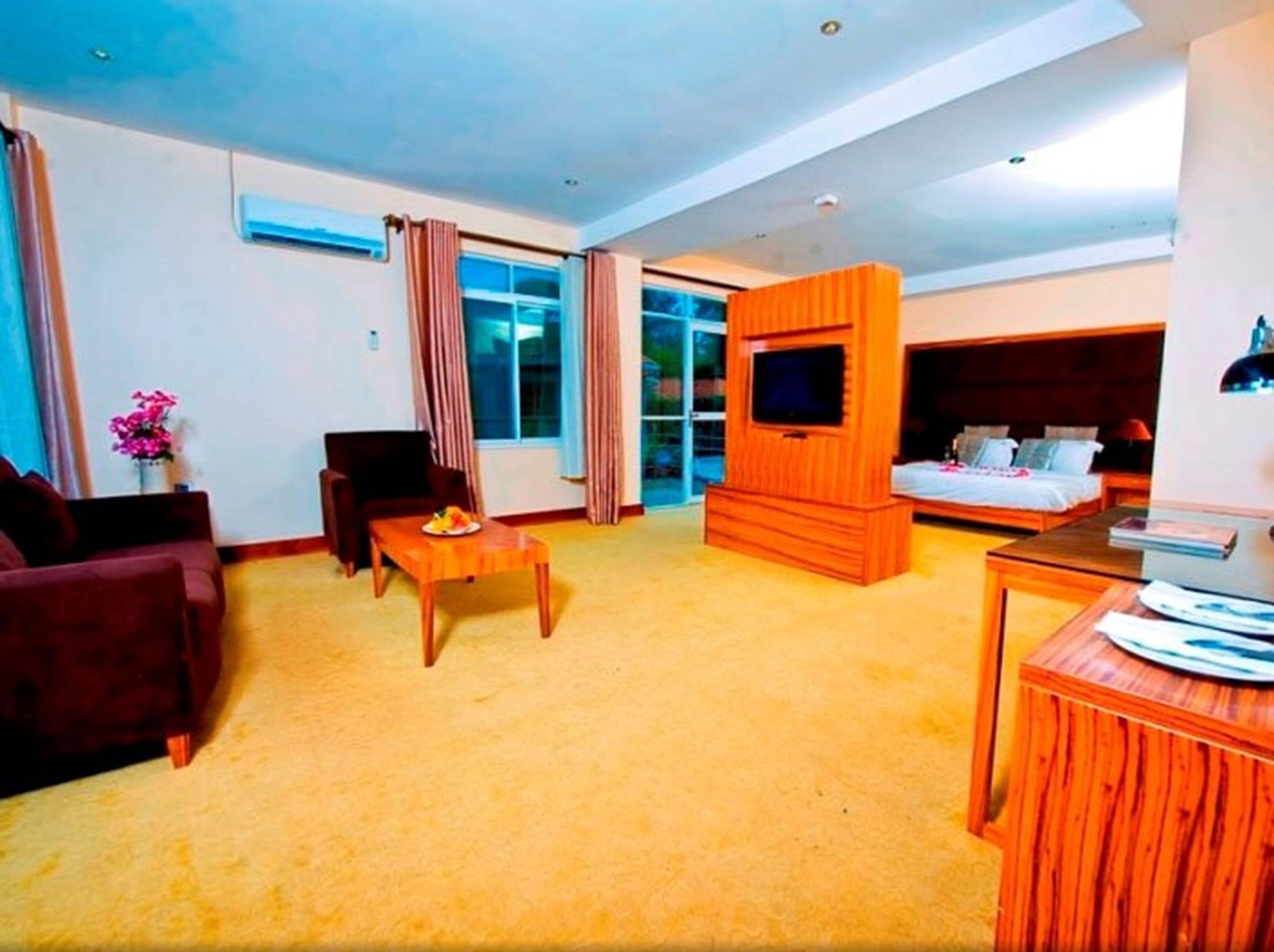 signature suite | living area | 32-inch tv with cable channels