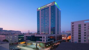 A multi-story Holiday Inn Express building with a modern design, featuring a prominent sign at the top. - Holiday Inn Express Hefei Huaihe Road by IHG (Hefei)