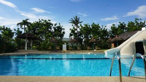 Outdoor pool, open 8 AM to 8 PM, pool loungers