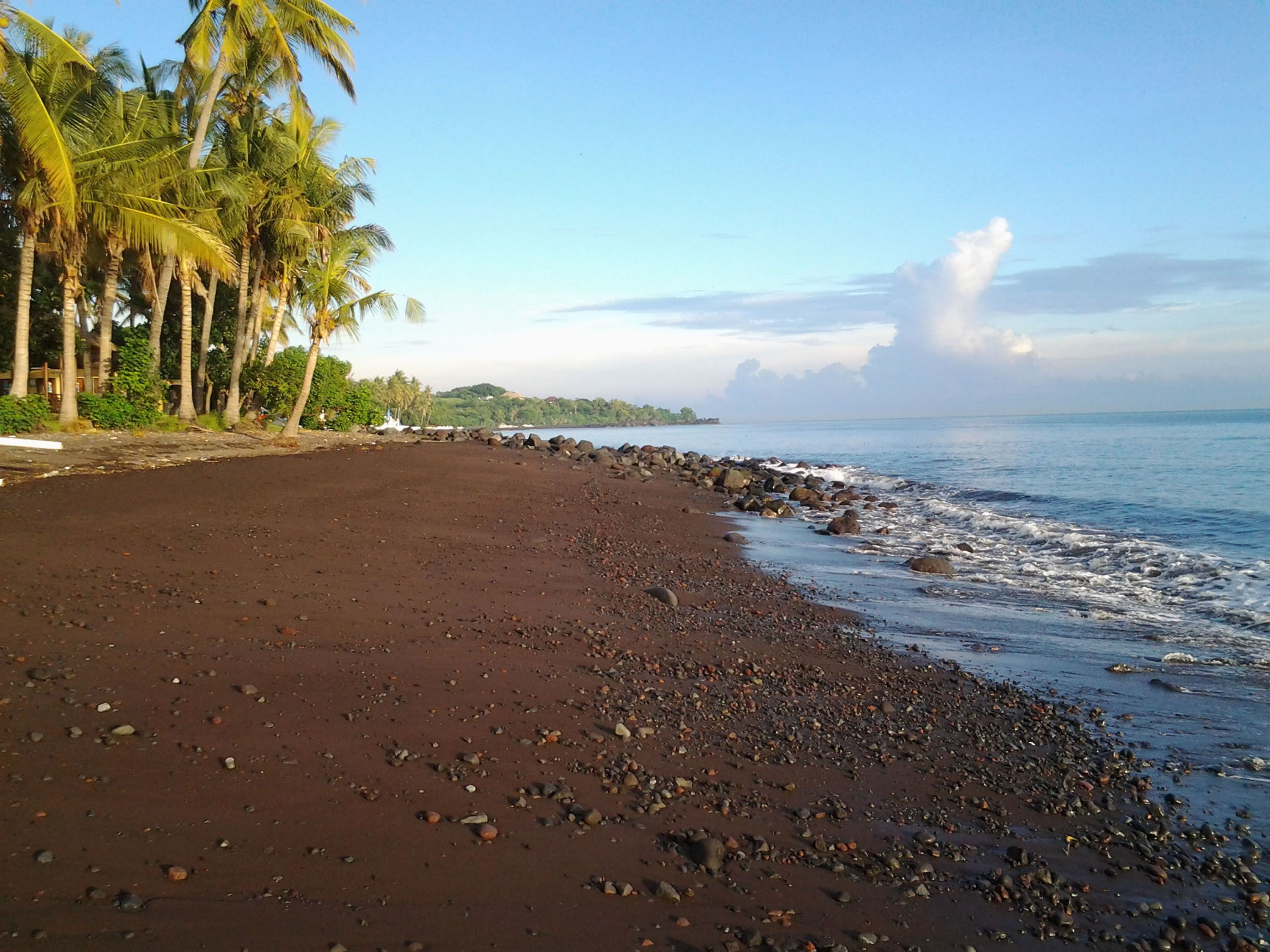 on the beach, black sand, beach towels, scuba diving