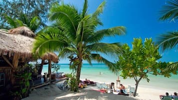 On the beach, sun loungers, beach bar