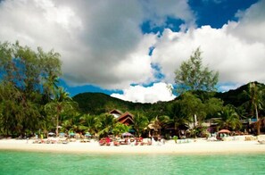On the beach, sun-loungers, beach bar