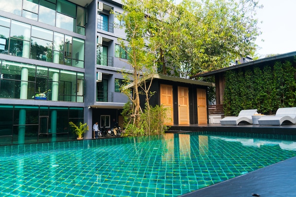 Outdoor pool, open 6 AM to 9 PM, pool umbrellas, pool loungers