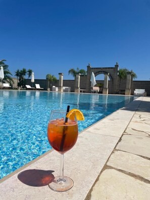 Outdoor pool, pool umbrellas, sun loungers