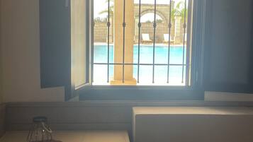 Junior Suite, Pool Access, Pool View | Living area | Flat-screen TV