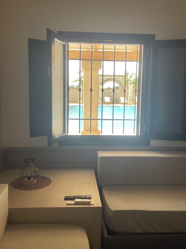 Junior Suite, Pool Access, Pool View | Living area | Flat-screen TV