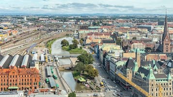 A cityscape with a prominent river, historic buildings, and a modern bridge.