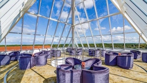 A modern rooftop terrace with a glass ceiling, offering expansive views of the landscape. - Grand Lubicz - Uzdrowisko Ustka (Ustka)