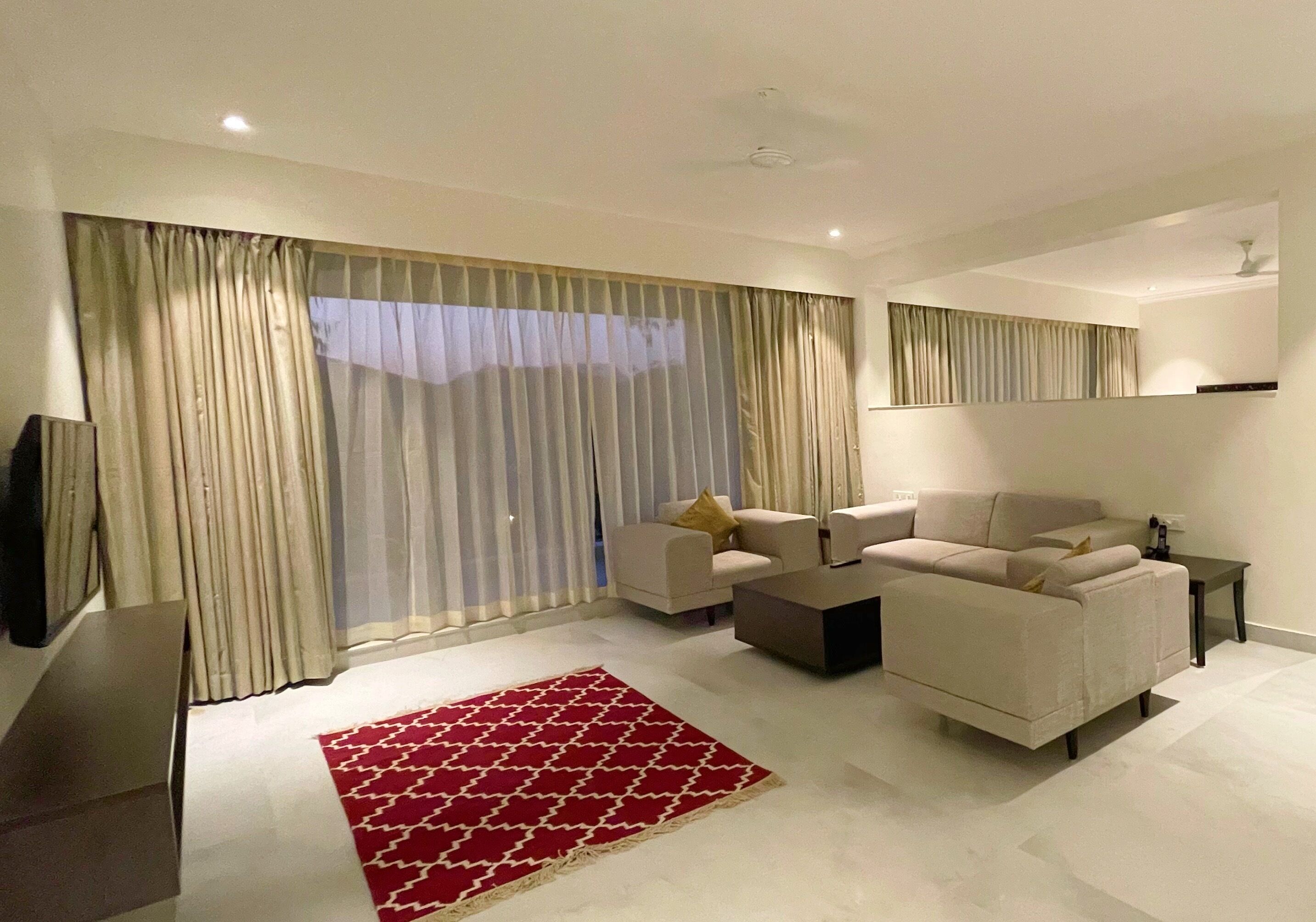 luxury studio suite | living area | 40-inch led tv with satellite channels, tv