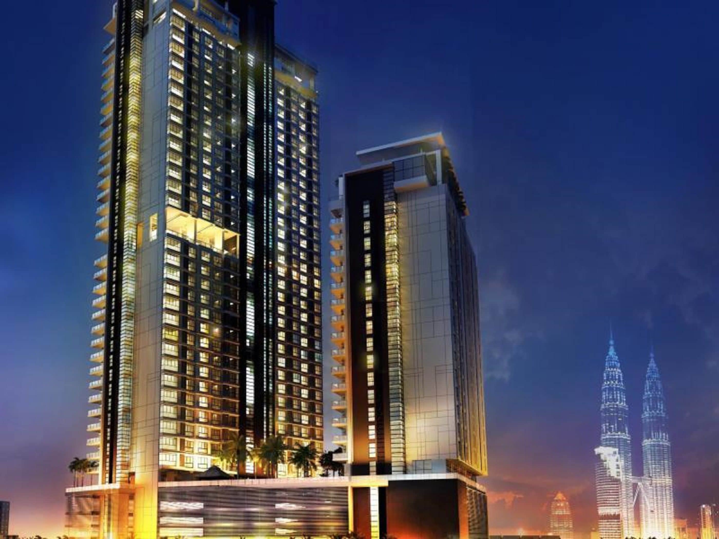 A high-rise hotel with multiple floors, large windows, and a modern architectural design.