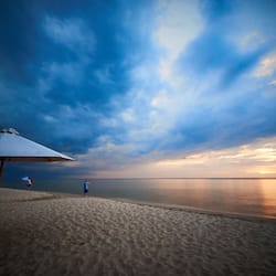 On the beach, white sand, sun-loungers, beach umbrellas