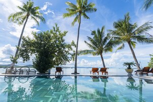 Outdoor pool, open 9:00 AM to 10:00 PM, pool umbrellas