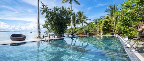 Outdoor pool, open 9:00 AM to 10:00 PM, pool umbrellas