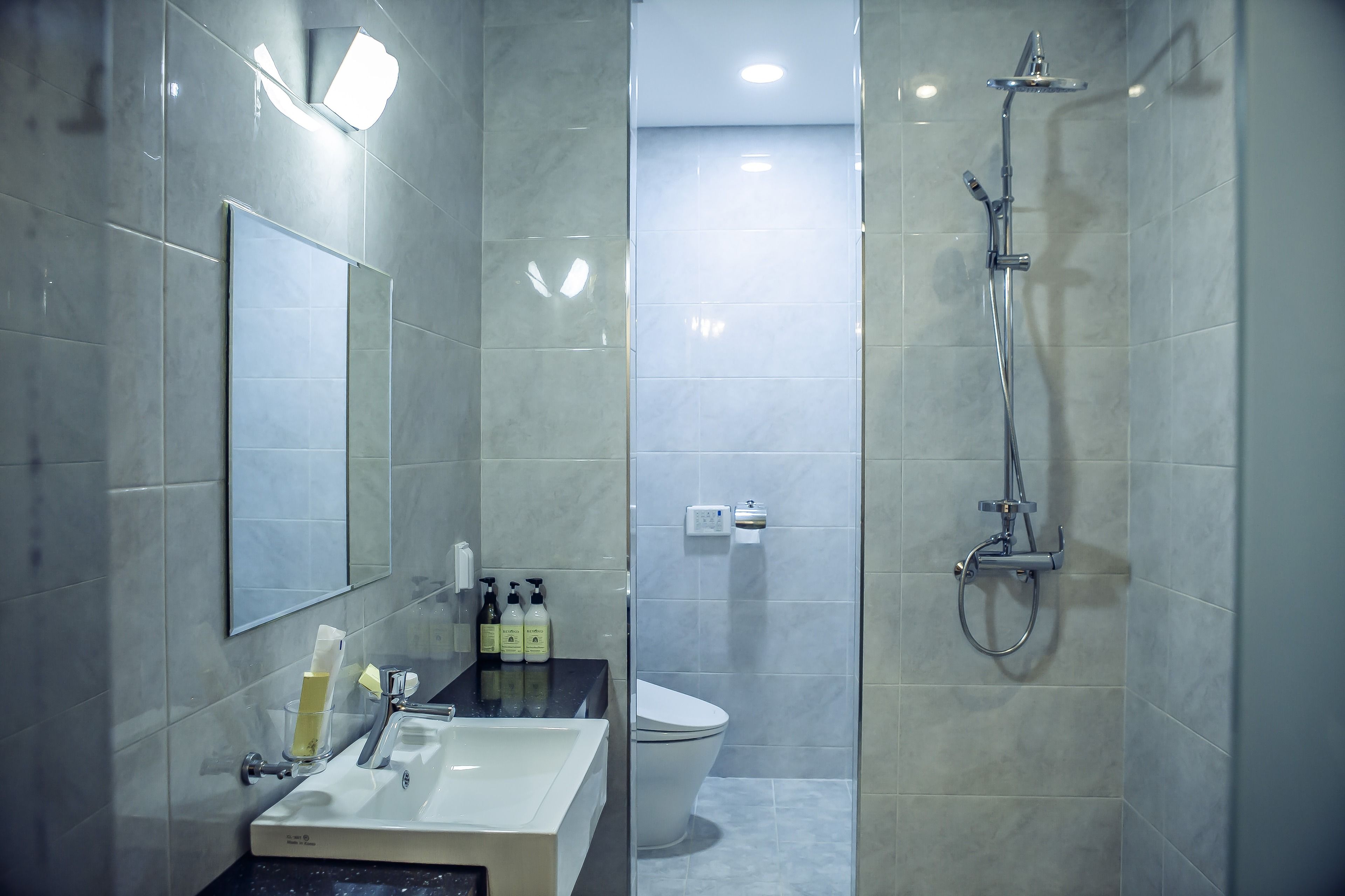 designer toiletries, hair dryer, bathrobes, slippers