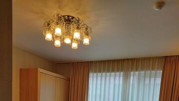 Deluxe Double Room | Living area | 42-inch LED TV with cable channels, TV, Netflix