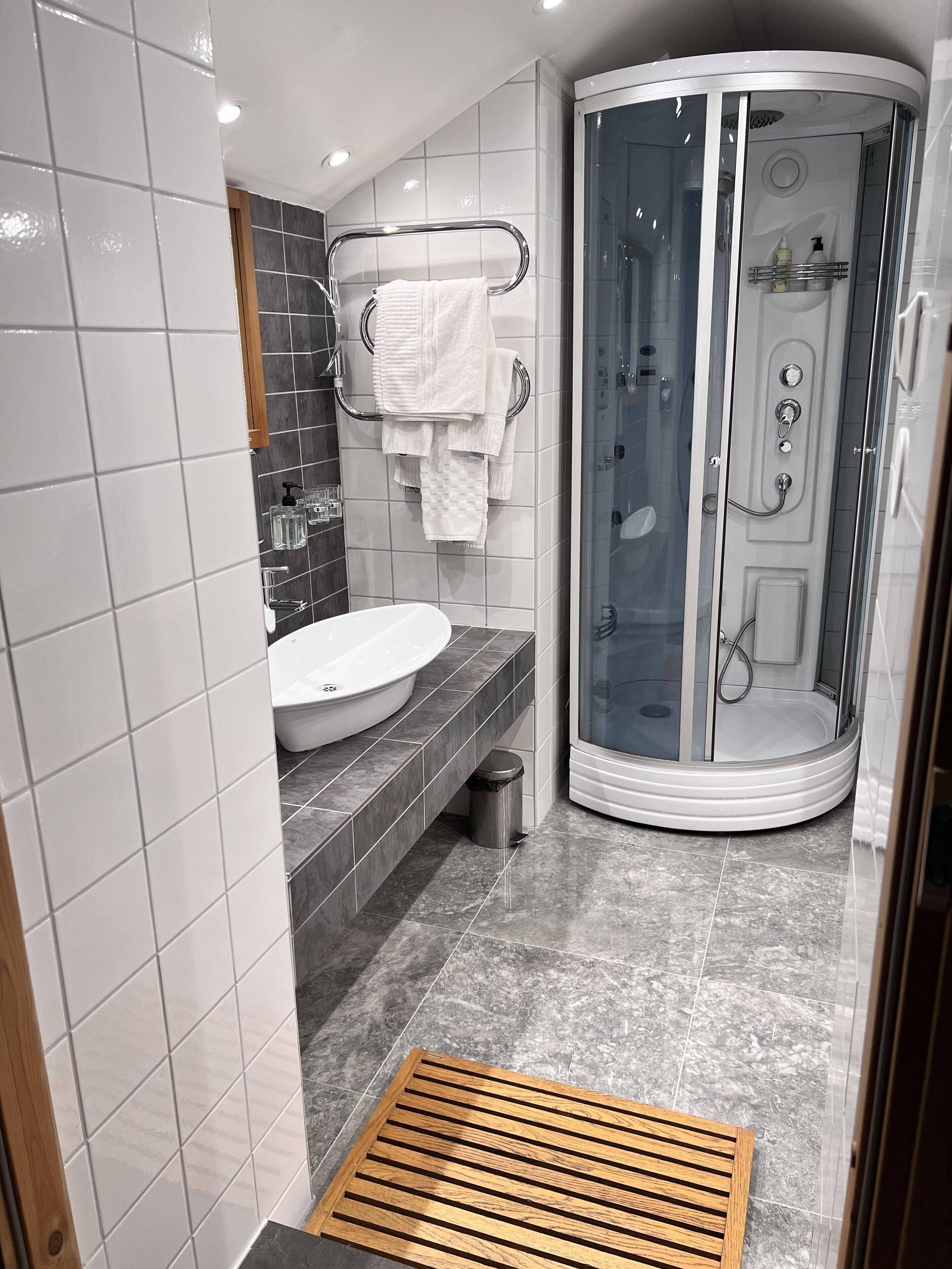 superior room | bathroom | shower, hair dryer, towels