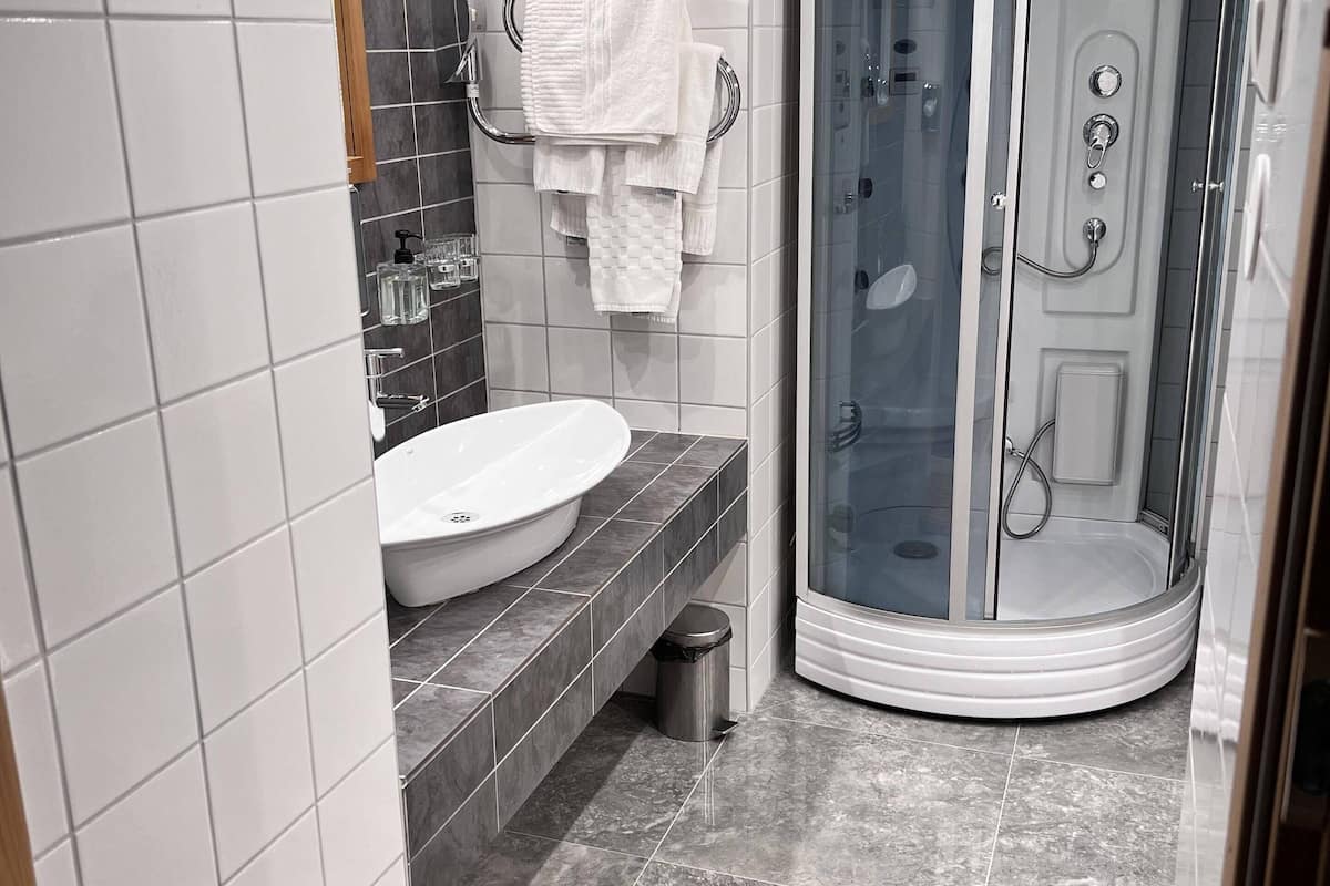 superior room | bathroom | shower, hair dryer, towels