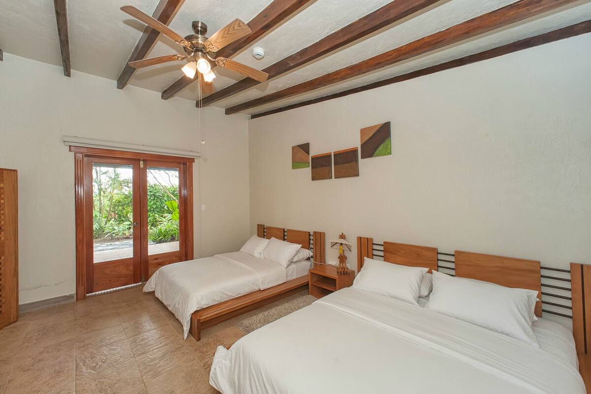 Suite, 2 Queen Beds, Hot Tub | Down comforters, WiFi (free), individually decorated, bed sheets
