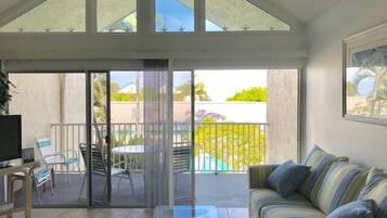 Unit 119 Courtyard View | Living room | Flat-screen TV