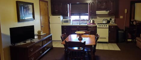 Family Suite, 2 Queen Beds | Private kitchen | Fridge, microwave