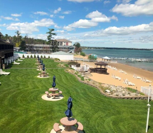 Relax in a serene beachside setting with comfortable seating areas and lounge chairs.