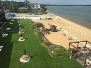 Enjoy the scenic views from our beachfront lawn, featuring outdoor seating areas and access to the sandy beach.