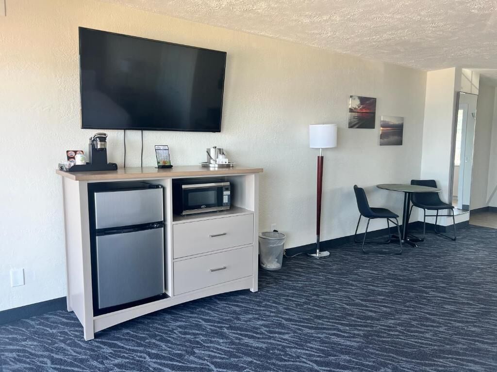 beach view balcony deluxe king | living area | 55-inch tv with cable channels