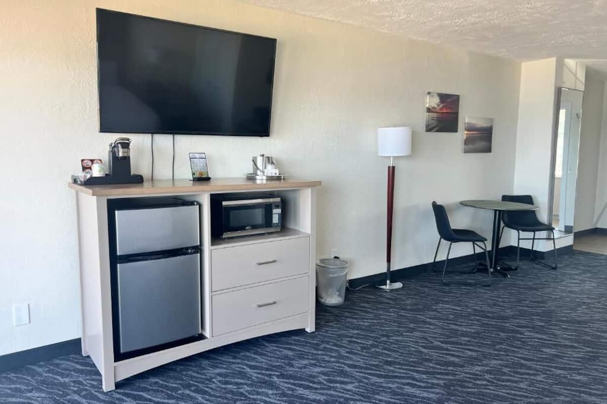 beach view balcony deluxe king | living area | 55-inch tv with cable channels