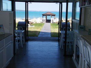Enjoy a beachside kitchen with a patio offering a view of the ocean and access to the beach.