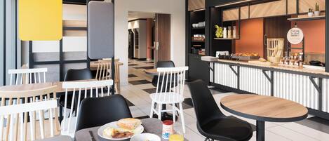 A modern cafe with tables and chairs, a breakfast spread, and a counter with food items.