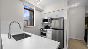 One Bedroom with Private Hot Tub | Private kitchen | Fridge, microwave, oven, stovetop - Alpenglow Lodge by MountainView (Whistler)