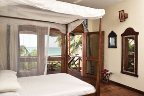 Large Deluxe Room Seaview | 1 bedroom, in-room safe, blackout drapes, bed sheets - Mnarani Beach Cottages (Nungwi)