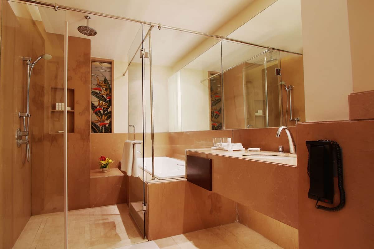 superior room, city view | bathroom | designer toiletries, hair dryer, bathrobes, slippers
