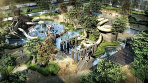 Un parc aquatique en plein air doté de diverses attractions aquatiques, notamment des toboggans et des piscines, le tout entouré d’arbres et de sentiers.