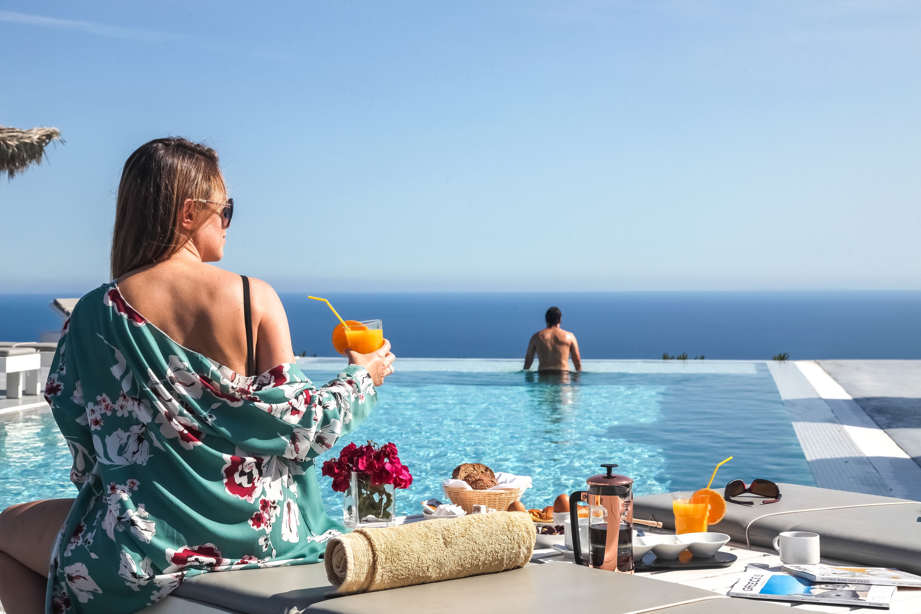 Seasonal outdoor pool, an infinity pool, pool umbrellas, sun loungers