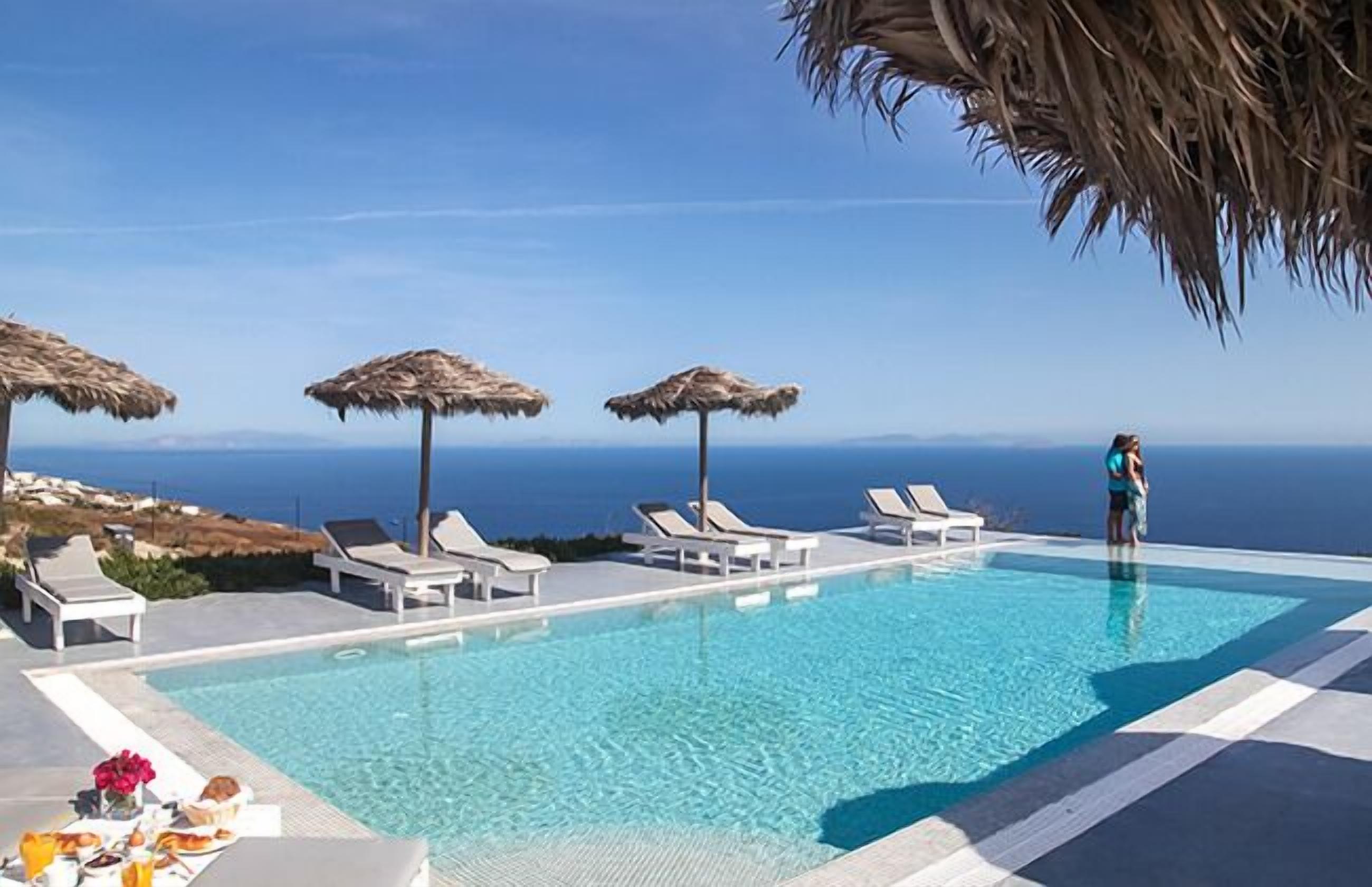 Seasonal outdoor pool, an infinity pool, pool umbrellas, sun loungers