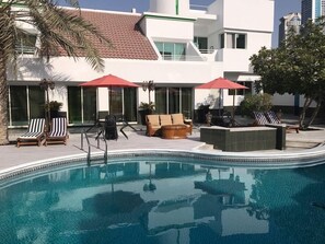 Outdoor pool, pool umbrellas, pool loungers
