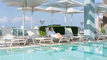 Outdoor pool, pool umbrellas, pool loungers