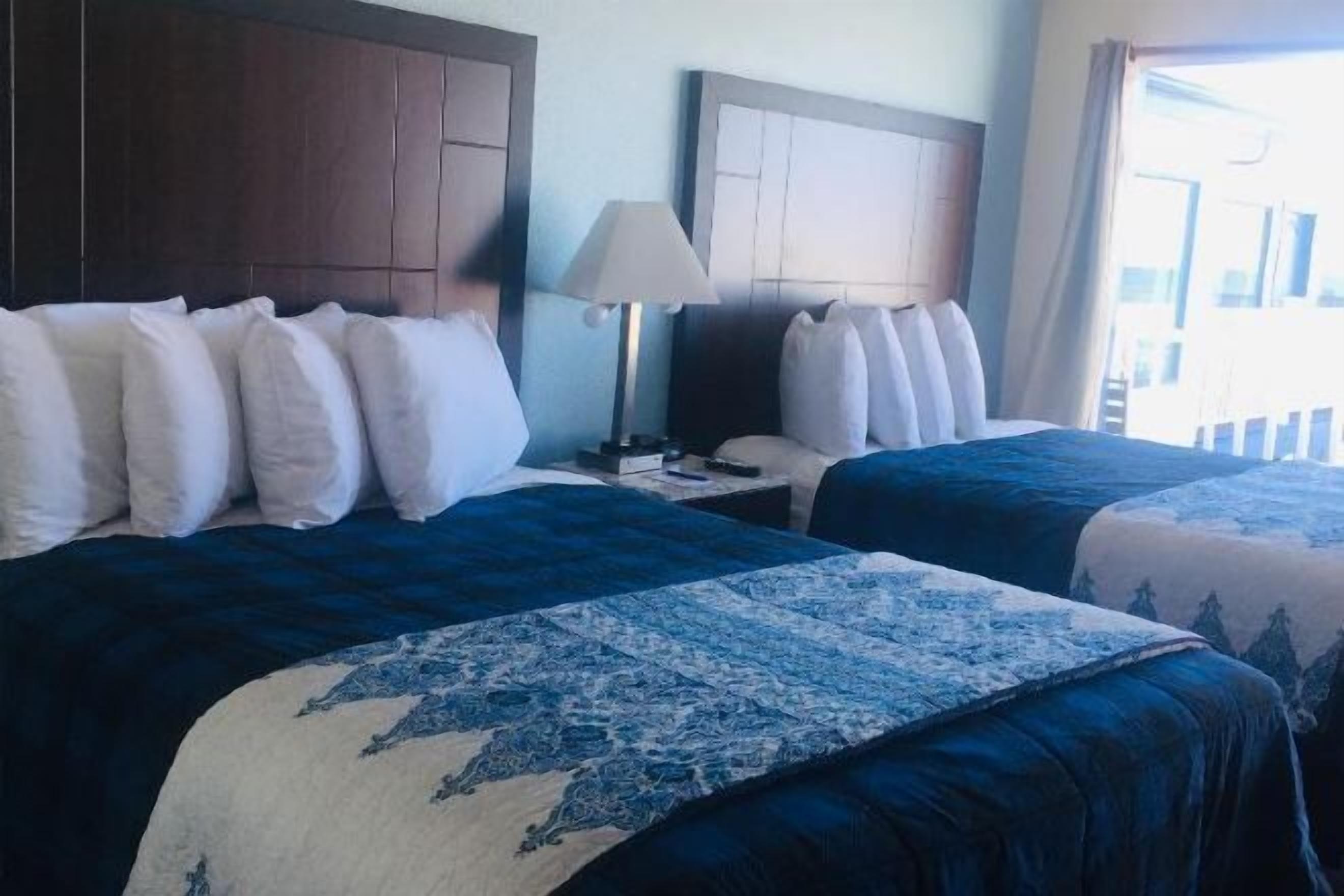 Premium bedding, pillow-top beds, blackout curtains, free WiFi