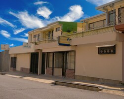 A building with a sign for 'Bamboo' and 'Jimenez & Mendel'.