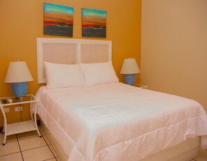 Habitación Deluxe | Ropa de cama de alta calidad y edredones de plumas