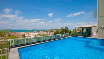 Outdoor pool, open 6:00 AM to 8:00 PM, pool loungers