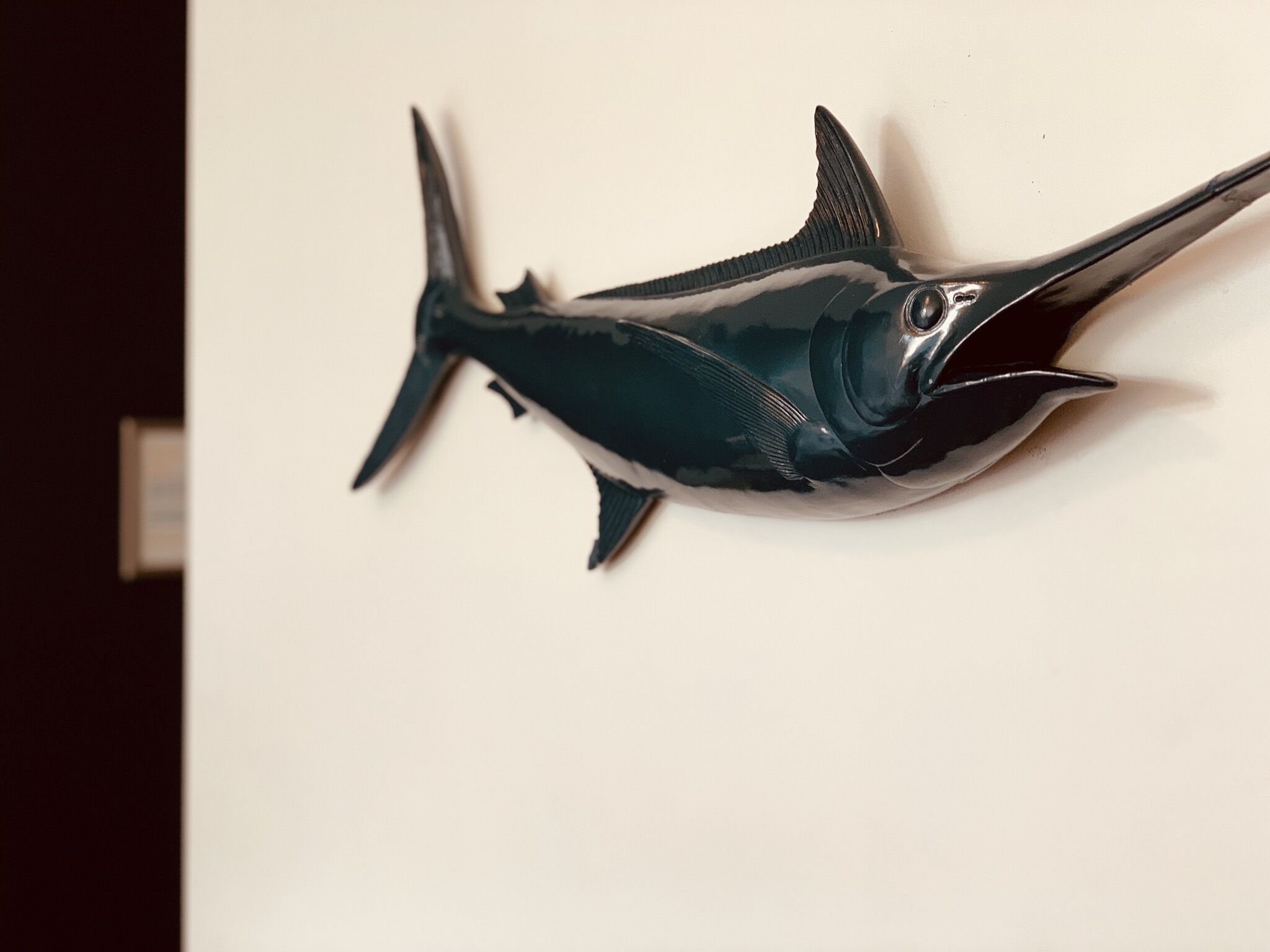 A wall-mounted sculpture of a fish.