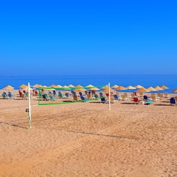 On the beach, sun-loungers, beach umbrellas