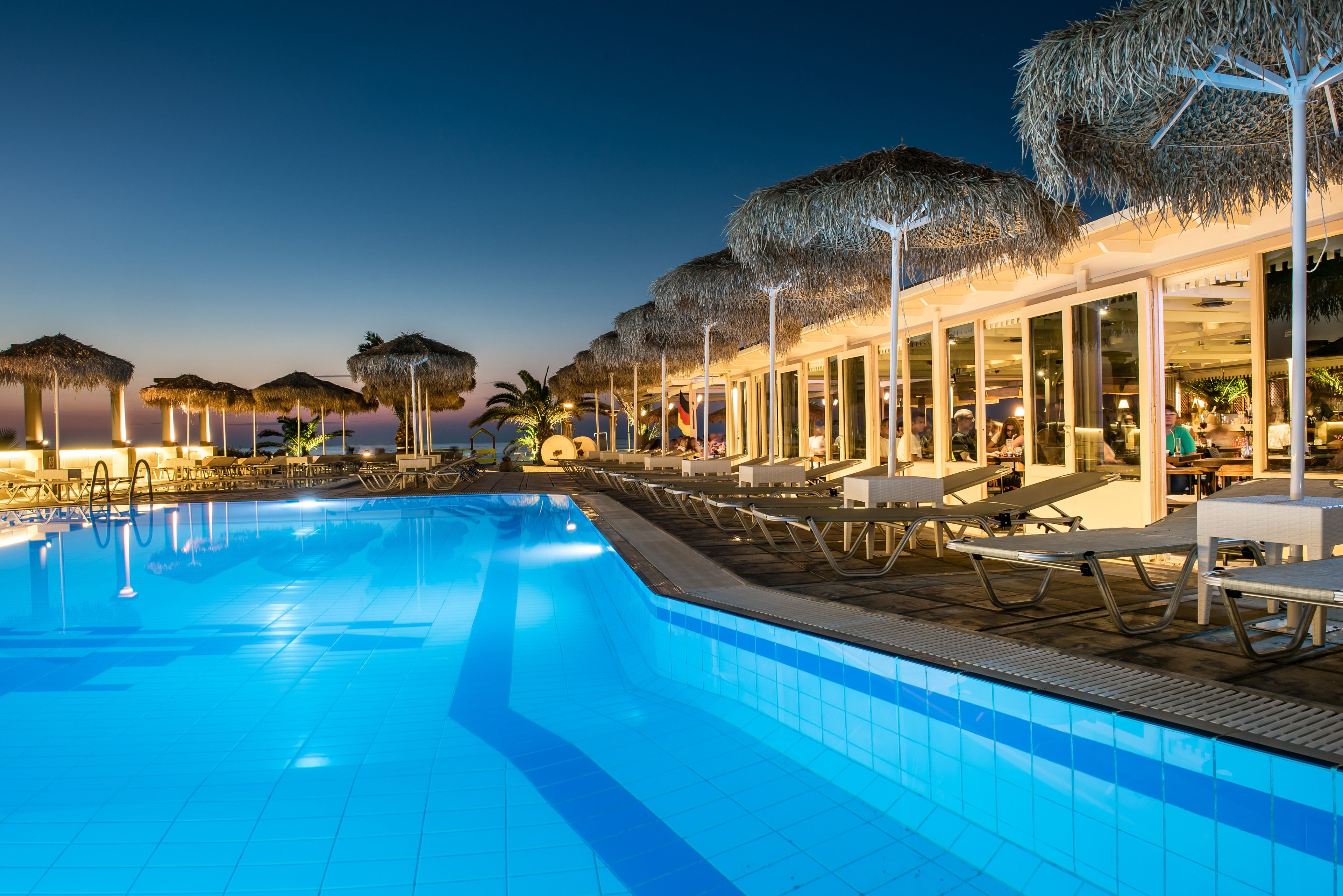 Outdoor pool, pool umbrellas, sun loungers